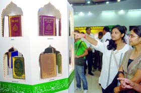 Girls admire an exhibition on the teachings of the Holy Quran organised by th Ahmadiya Muslim Jamaat in New Delhi on Friday.