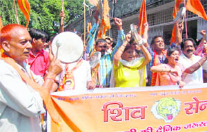 Shiv Sena workers stage a protest in front of the office of the Dehradun District Magistrate on Friday. 
