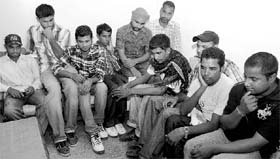 Some of the victims who were fortunate to survive the ordeal and return alive seem to be still in a state of shock (left)