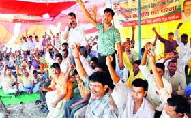 Liberty workers who lost their jobs during an agitation in 2006 on a dharna outside the shoe factory at Gharonda, Karnal, on Friday.