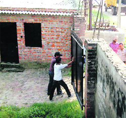 A team of the PPCB tries to enter a plastic bag manufacturing unit at Raowali village. 