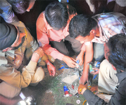 A bomb disposal squad defuses an explosive-like device recovered in the Belicharana area of Jammu on Friday. 