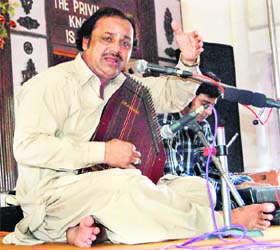 Munir Hussain Shakar from Pakistan performs at the Khalsa College of Education in Amritsar on Saturday