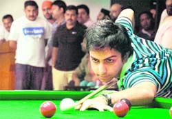 Pankaj Advani plays a shot during the National Six-Red Snooker Championship at the Chandigarh Club on Sunday.