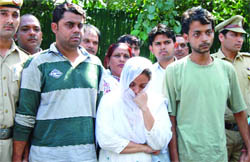 The accused in the custody of the Delhi police.