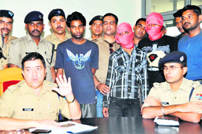 Three persons arrested on a charge of murdering an old woman are presented before mediapersons by the SSP, GN Goswami, in Dehradun on Saturday.