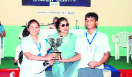 A trophy is presented to two students at the AC Deb Memorial Inter-school English Debate competition held in Dehradun on Saturday. A Tribune photograph