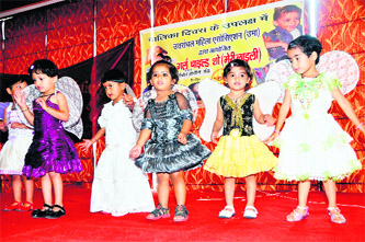 Children present an item at a function to mark Girl Child Day in Dehradun on Saturday. 