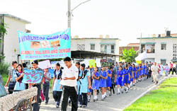 Schoolchildren carry banners and placards in a rally against malaria and dengue organised by the Air Force Wives Welfare Association (Local) at Sirsa