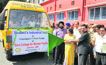 Dr Manohar Lal Sharma, Minister for Higher Education, flags off the students industrial tour in Jammu on Saturday. 