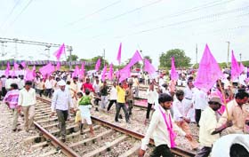 TRS and BJP workers during the rail roko protest in Hyderabad on Saturday