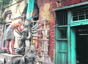 Since the late 19th century, hundreds of artisans of Kumartuli have been designing the Durga idols for homes and the puja pandals around the country 