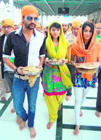 Cast of Punjabi film Yaar Anmulle Yugraj Hans, Jenny and Kajal Jain in Amritsar on Sunday. 