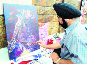 An artist during the workshop at KT Kala art gallery in Amritsar on Sunday. 