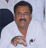 Transport Minister Surjit Kumar Jiyani addresses mediapersons in Bathinda on Sunday. A Tribune photograph