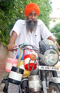 Baljinder Singh with his tiffins. 