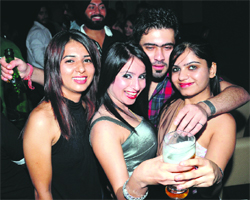 Partygoers revel during a birthday party at a lounge at 1 am on Saturday