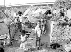 Slum-dwellers remove their belongings during the anti-encroachment drive