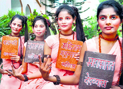 Students of Arya Kanya Intermediate College, Roorkee, present a skit during a district Sanskrit competition in Haridwar on Sunday