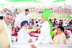 INLD chief Om Prakash Chautala (second from right), Punjab Chief Minister Parkash Singh Badal and Ajay Singh Chautala, candidate for the Hisar Lok Sabha seat, at the partys samman rally in Hisar on Sunday