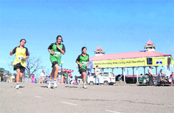 Girls take part in the Half Marathon in Shimla on Sunday.