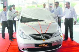 A new car being unveiled at a car showroom in Jalandhar. A Tribune photograph