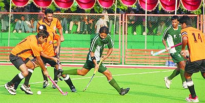Jalandhar Tigers and Hoshiarpur Rangers in action on the inaugaral match of Punjab Hockey League at PAP Hockey Stadium in Jalandhar on Sunday.