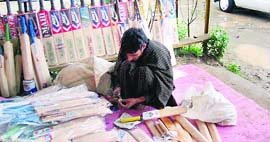 A bat maker at work in one of the states many factories.