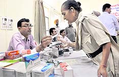 A doctor examines a cop during the multi-speciality health check-up camp at Police Lines, Ludhiana, on Sunday. 