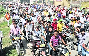 Youngsters take out a rally to pay tributes to martyr Bhagat Singh in Ludhiana on Sunday. 