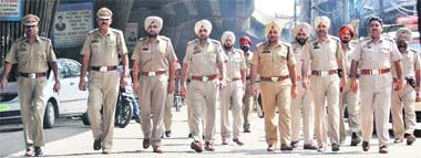 ADCP-I MS Dhesi (third from right) leads a team of SHOs during a flag march in Ludhiana.