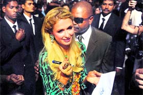 US socialite Paris Hilton signs autographs after inaugurating her boutique in Mumbai.