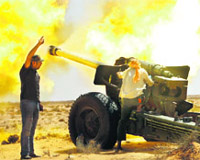 Anti-Gaddafi fighters fire heavy artillery near Sirte on Sunday.