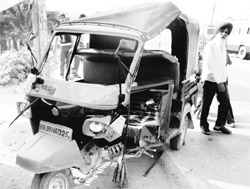 The damaged auto-rickshaw that overturned on the Chandigarh- Ambala highway in Dera Bassi on Monday.