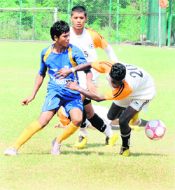 Players in action during the 9th Administrators Challenge Football Cup for Boys (U-17) at Sports Complex in Sector 42 of Chandigarh on Monday. 