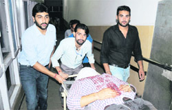 Hardeep Singh, newly elected president of the DAV College Students Council, who was injured in an attack in Sector 37 being taken for a CT scan at a hospital in Chandigarh on Monday.