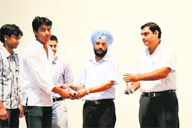 Prof SS Rattan, Mechanical Department, NIT, gives away a prize to a winner of an event in Kurukshetra.