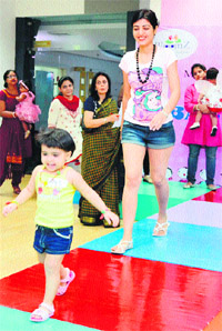 A child walks the ramp at a baby show in Gurgaon. 