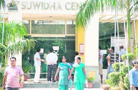 Disappointed residents return after reading the notice pertaining to the strike by employees put up outside the Suvidha Centre in Jalandhar on Monday