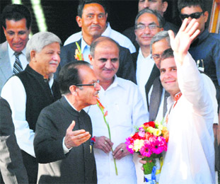 AICC general secretary Rahul Gandhi waves on arriving at the SKICC in Srinagar on Monday.