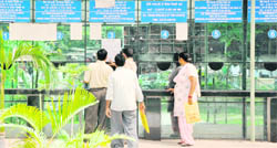 People reading a note put up at Suvidha Centre announcing the strike