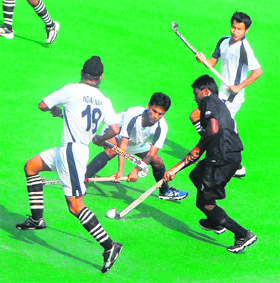 A match in progress between Indian Navy and RCF at the hockey stadium in Chandigarh on Monday. 