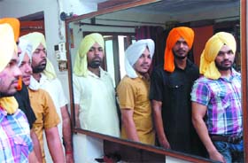 Young men pose in turbans tied in Bhagat Singh style in Bathinda