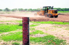 A field being levelled at one of the sites acquired for the Aerocity project in Mohali.