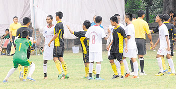 Players of Mohun Bagan (white) and Sarv Shiksha Abhiyaan of Mizoram enter into an altercation during a match and referee Arun Sharma tries to pacify them. A series of such incidents have been reported in the past.