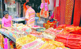 Chunnis and other puja items on sale on the eve of Navratras in Dehradun on Tuesday.