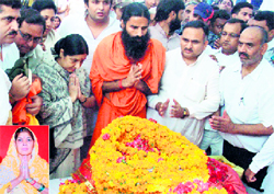Baba Ramdev, BJP leader Sushma Swaraj join others in paying tributes to Raj Bala (inset) before her cremation at Bhatana Zafarabad village (Sonepat) on Tuesday