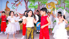 Students perform during a musical event organised by the Adhytamic Sangeet Sadan at Aglow Kids School in Jammu 