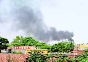 A chimney of a factory polluting the Ludhiana sky