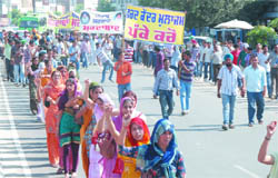 Staff of the Punjab Land Records Society hold protest march demanding regularisation of their services in Bathinda 